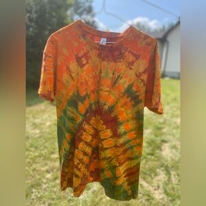 Tie dye tshirts diffrent sizes different colours. This one’s are orange/lemon .